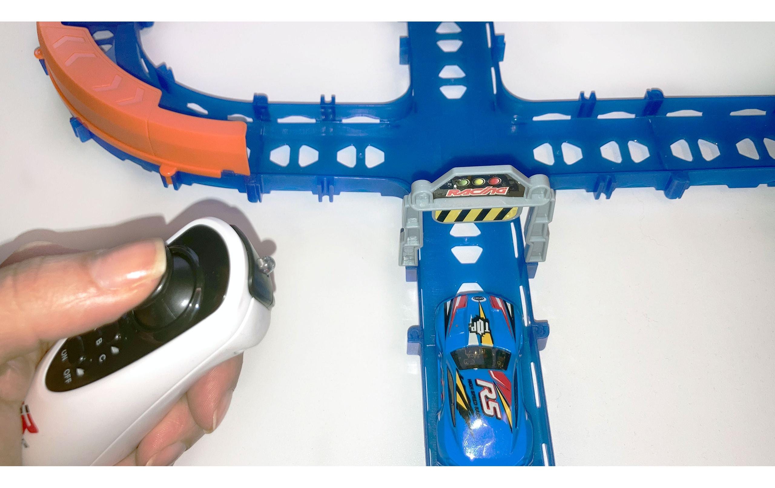 Amewi Magic Traxx Glow Rennbahn 113-teilig mit 2 Autos